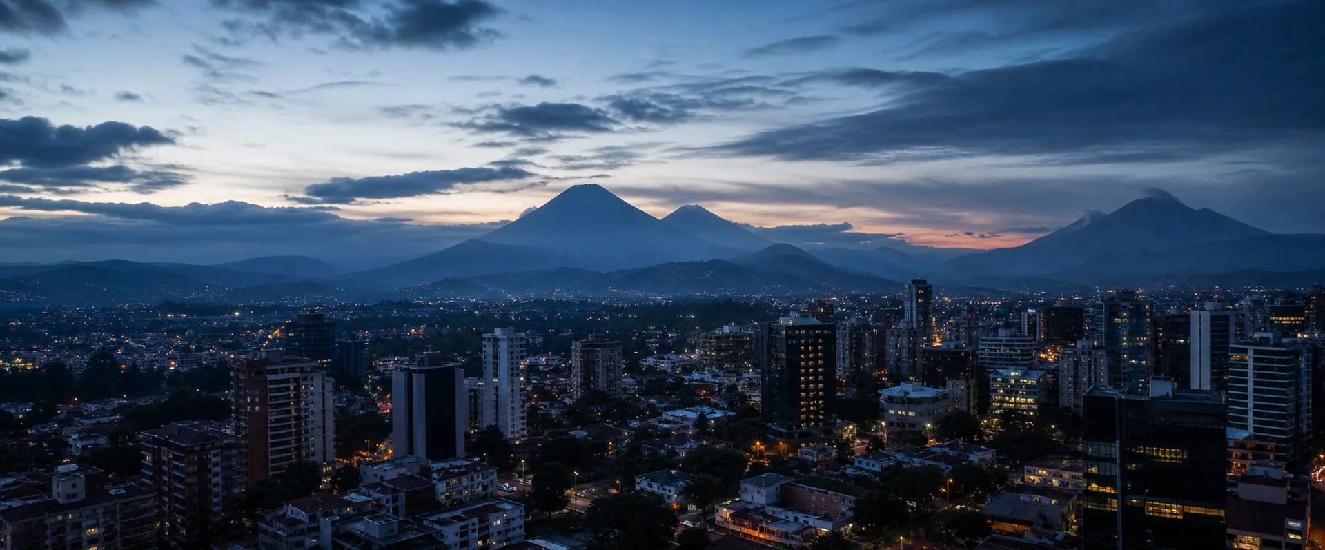 Guatemala City and volcanic skyline at blue hour, representing GSquared's international web work