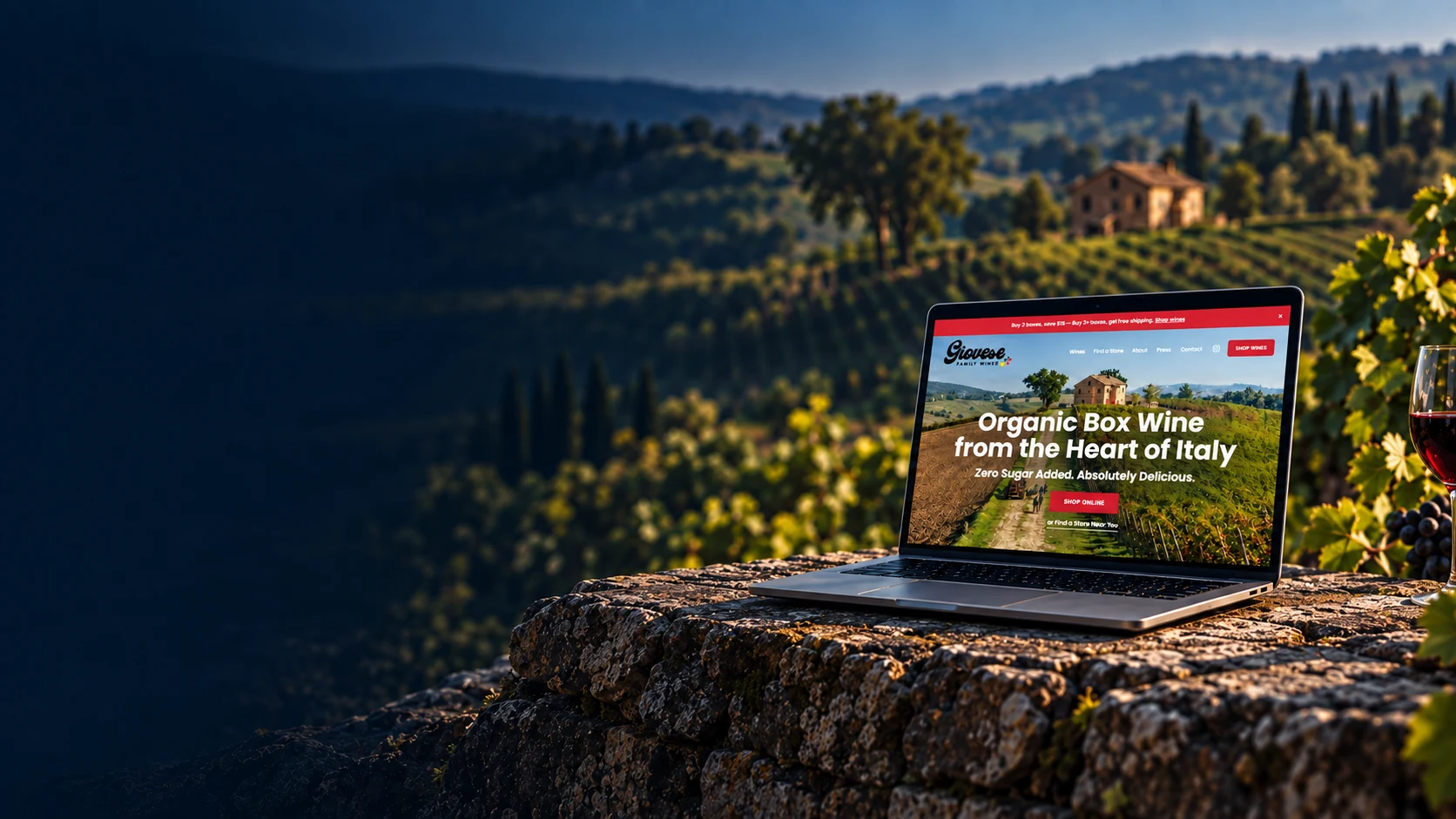 Giovese Shopify storefront on a laptop set into a vineyard scene